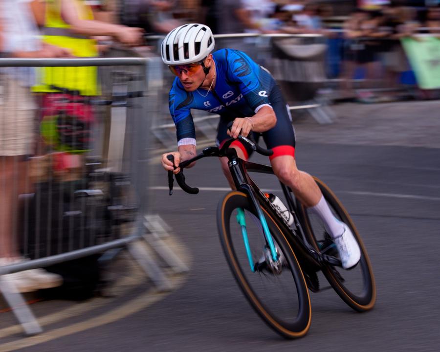 Callum Laborde cornering at speed in a criterium